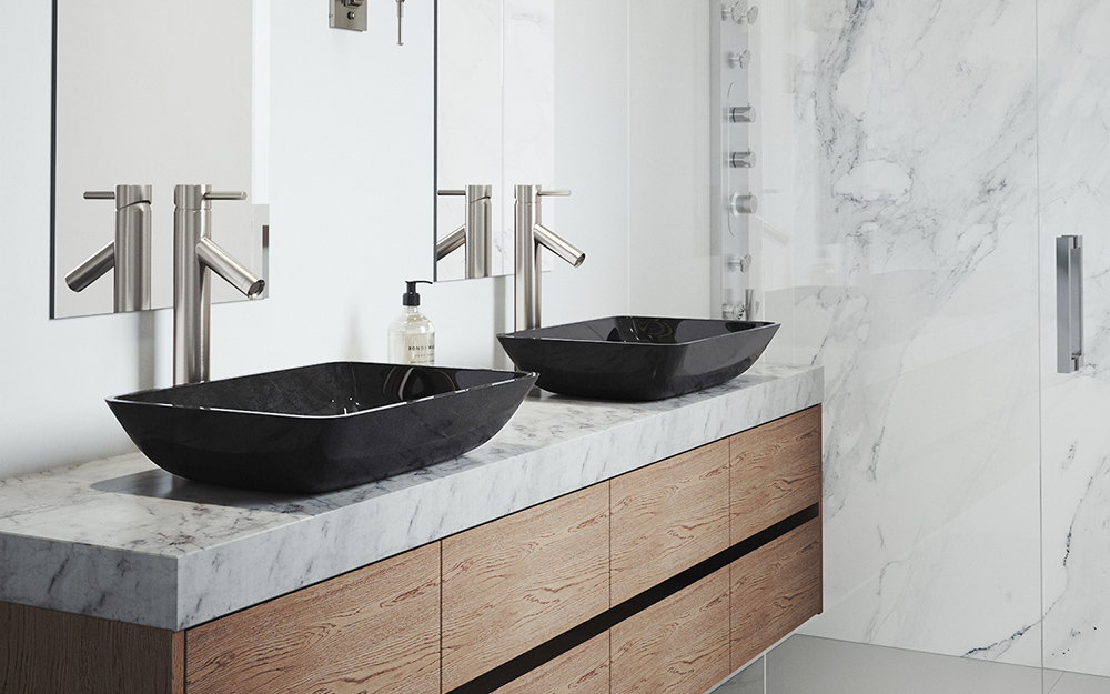 A bathroom features a double vanity with black vessel sinks on a stone countertop