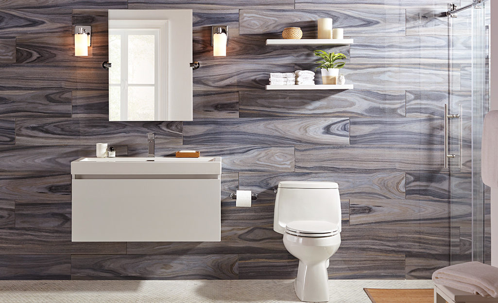 Wood-grained tile on a bathroom wall.