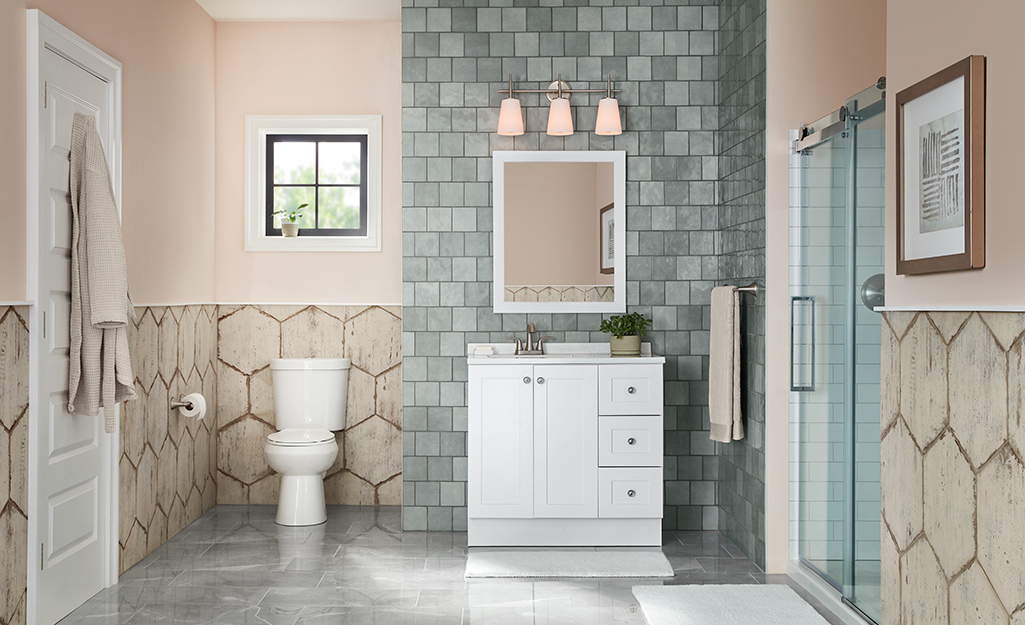 A bathroom with a mix of wall tile patterns.
