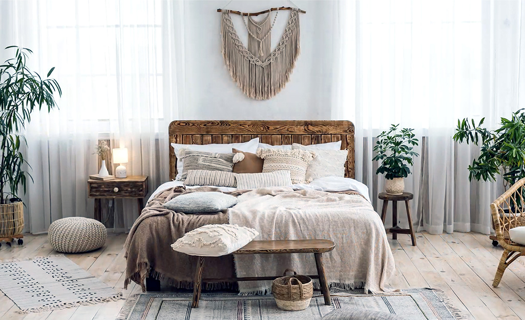A bedroom decorated in a Bohemian style with natural details.