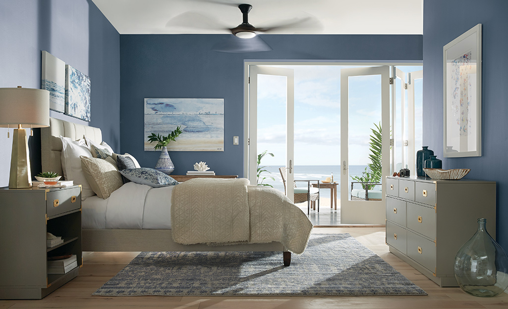 Master bedroom with light blue walls. 