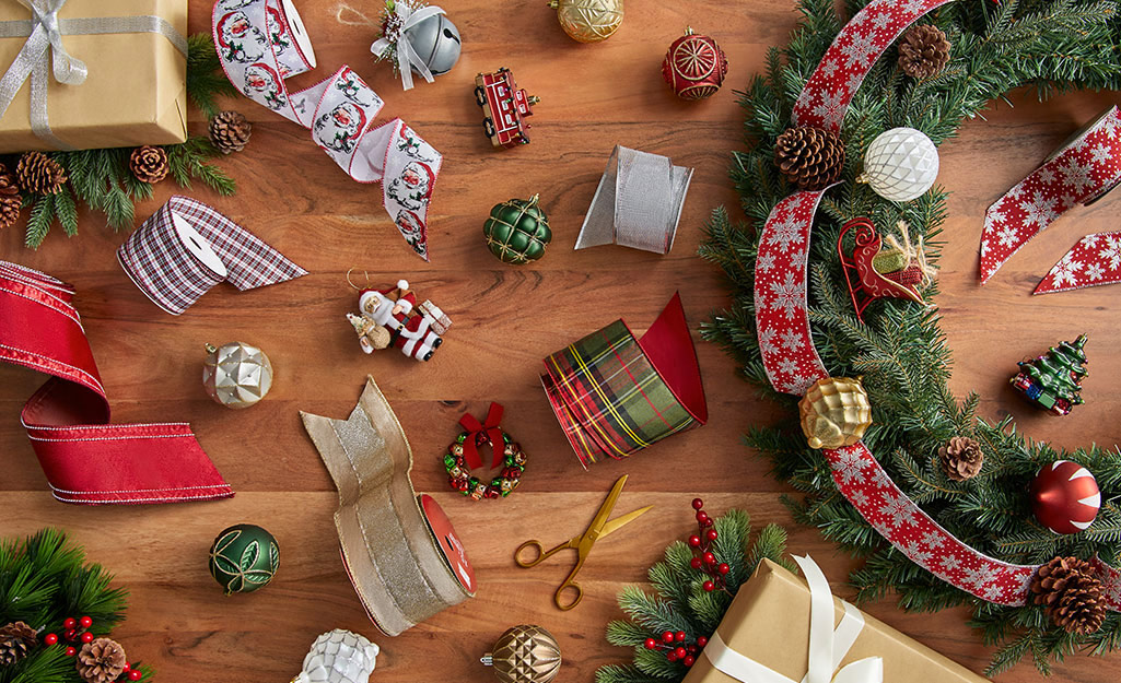 Accessories for artificial Christmas tree laid out on the floor.