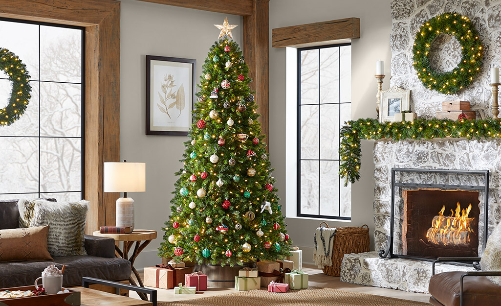 A decorated artificial Norway spruce in a holiday living room.