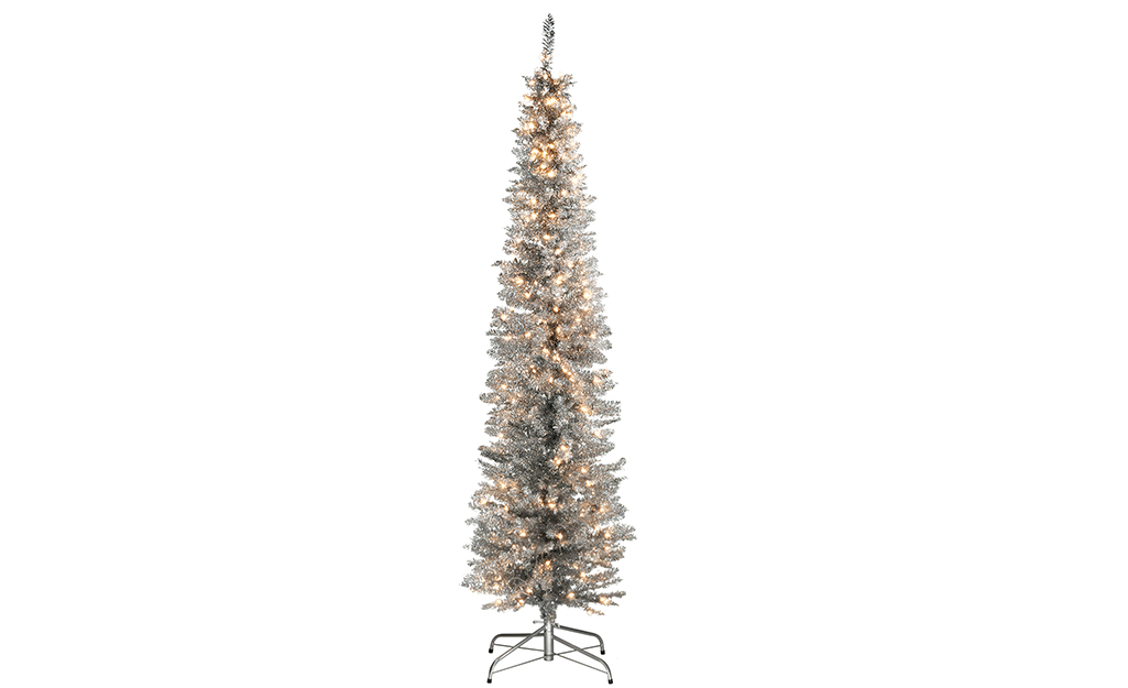 A decorated pre-lit silver tinsel tree.
