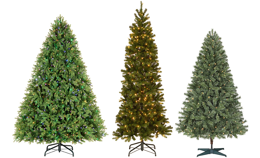 Three artificial Christmas trees in full, slim and medium widths.