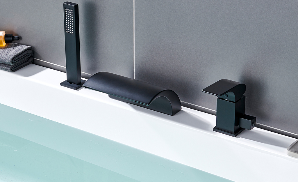 A black matte finish on a bath faucet.