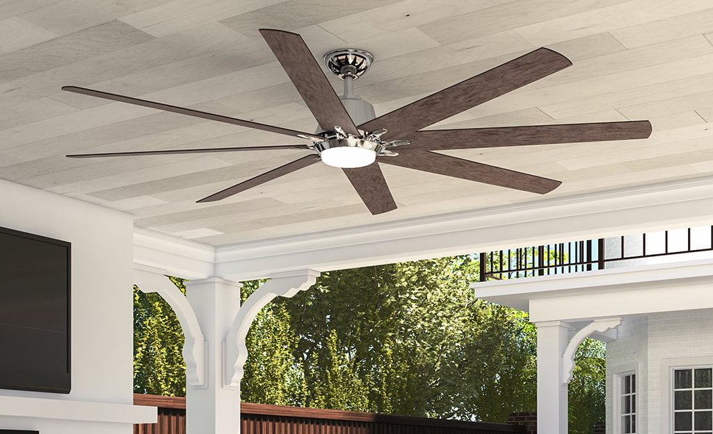 An outdoor ceiling fan installed on a patio.