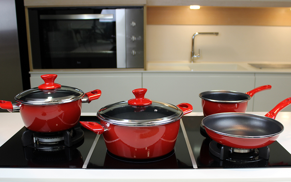 A porcelain enamel cookware set on a countertop A porcelain enamel cookware set on a countertop