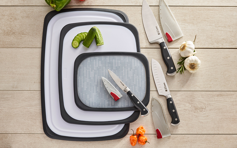 Plastic and poly cutting boards with chef's knives.