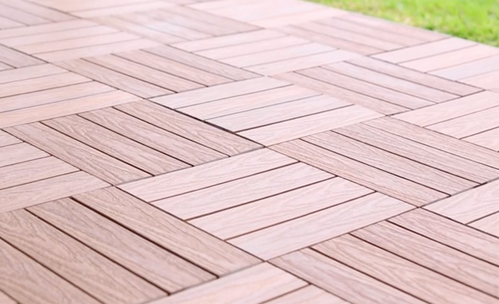 A close up of plastic decking arranged in a checker pattern.