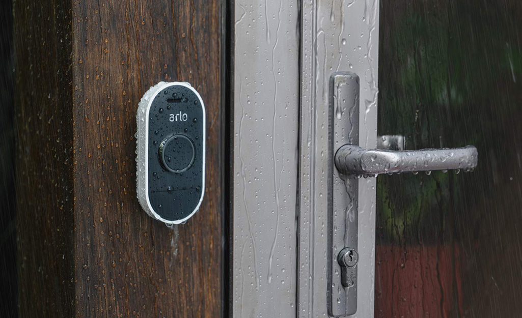A weatherproof smart doorbell in the rain.
