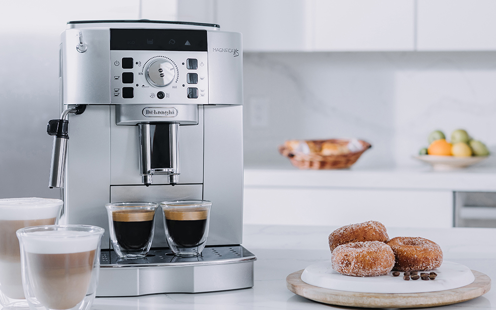 A super-automatic espresso machine on a kitchen countertop.