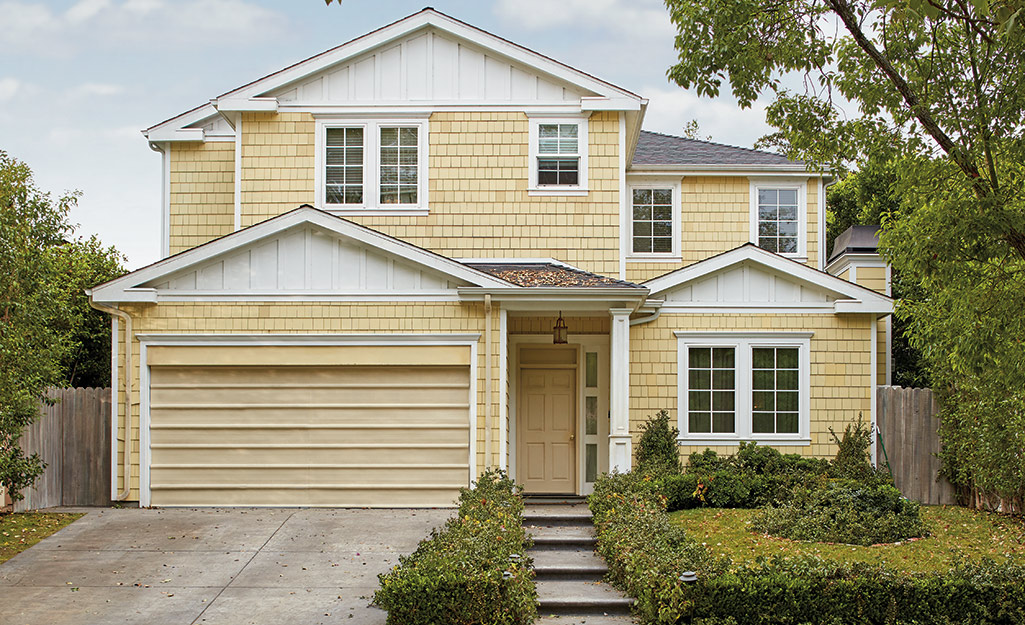 The exterior of a yellow house.