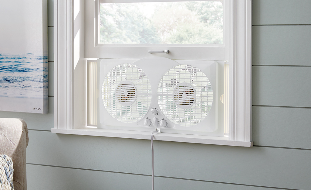 A window fan installed in a room.