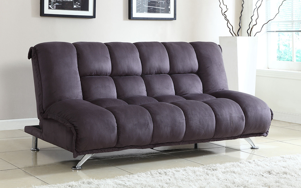 A brown trifold futon in a room.
