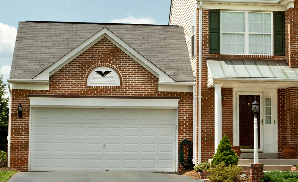 A single garage door for a Craftsman-style home.