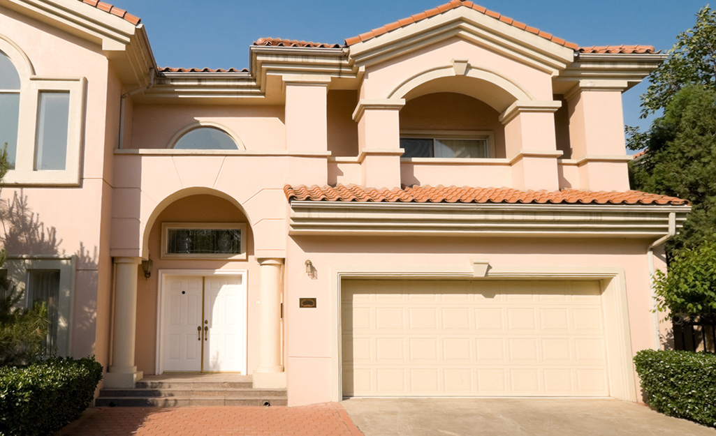 A garage door of a house designed in Mediterranean style.