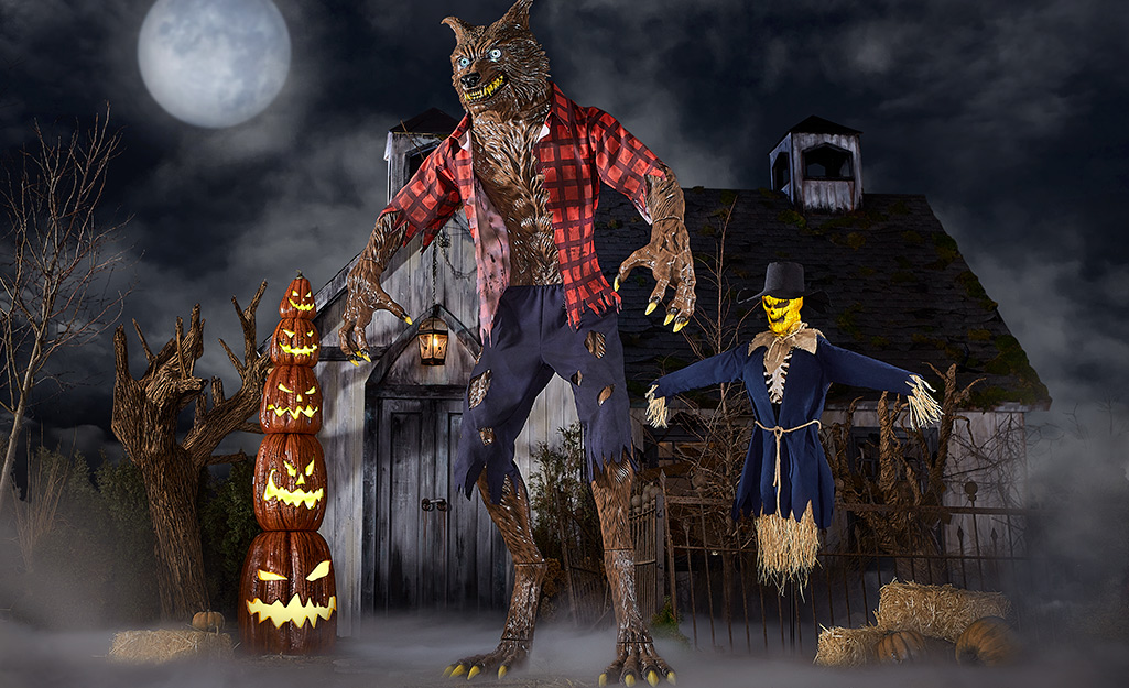 Animatronic werewolf placed in the center of a Halloween display.