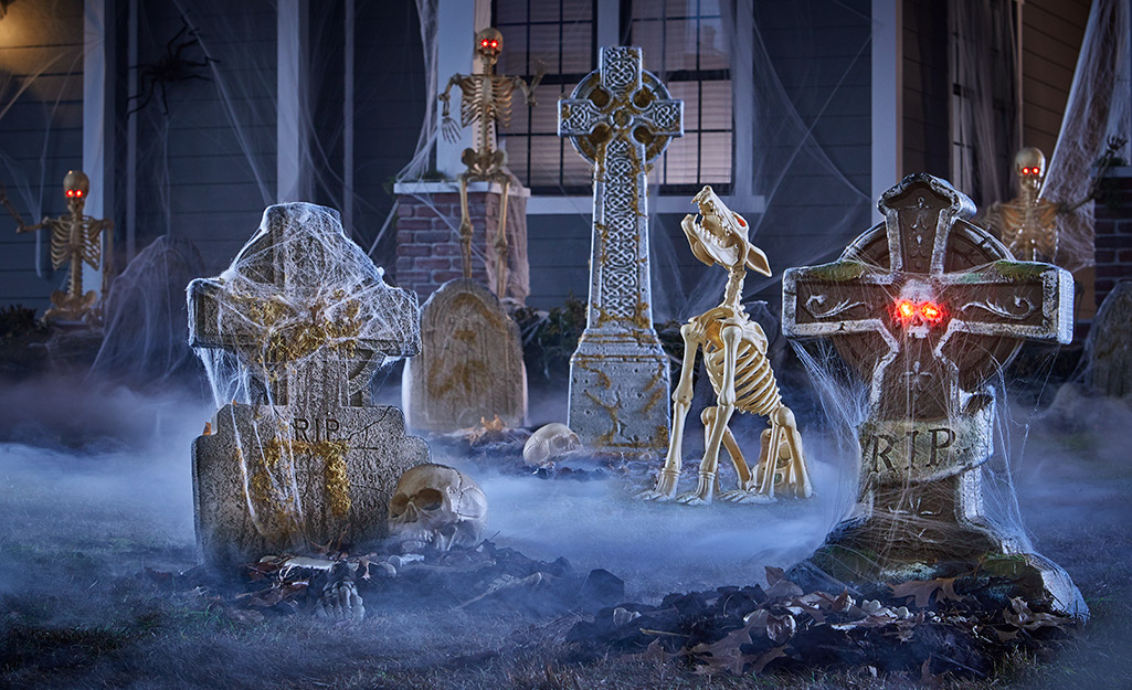 Cemetery gravestones and skeleton dog in a Halloween display