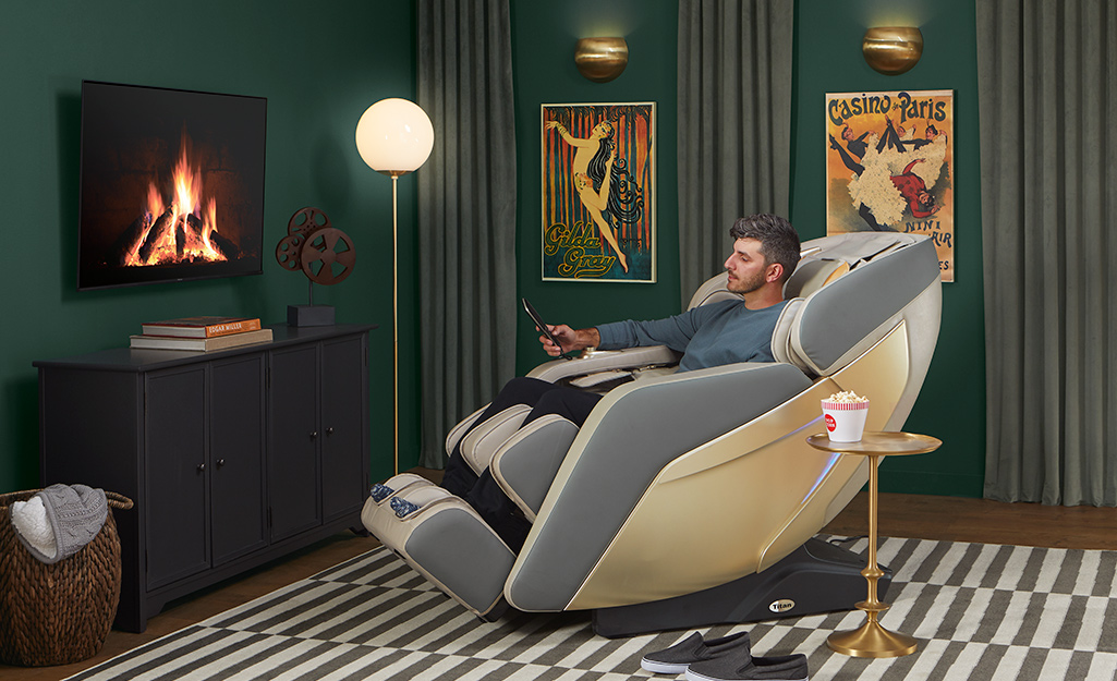 An all-in-one massage theatre chair in front of a television.