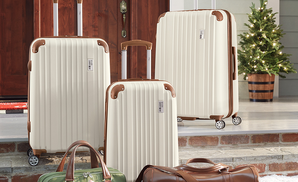 A nice set of white luggage.