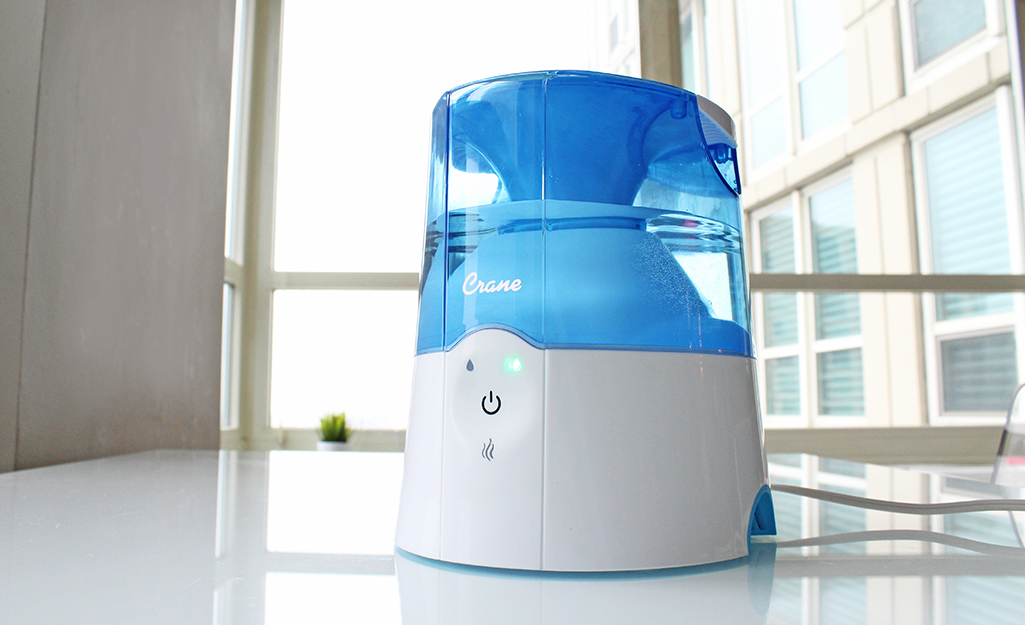 A humidifier sits on a counter. 