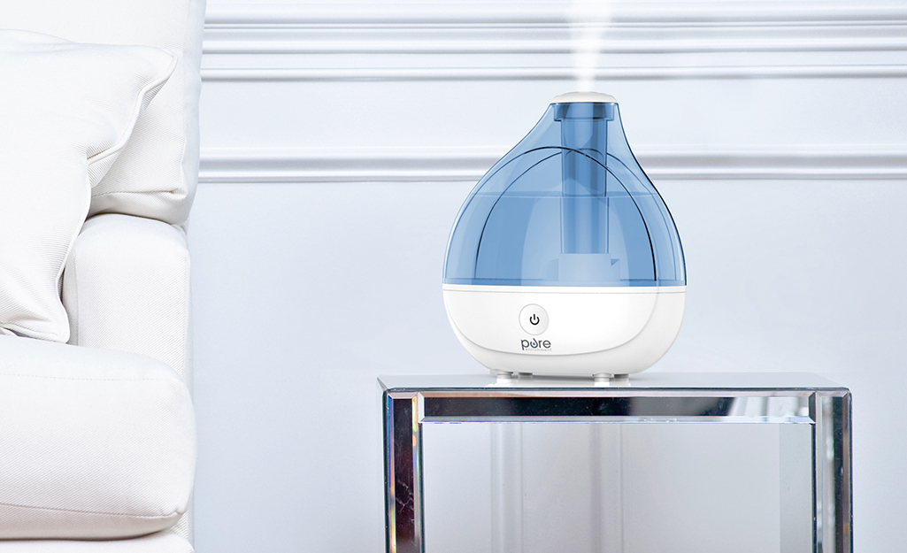 An ultrasonic humidifier working in a living room. 