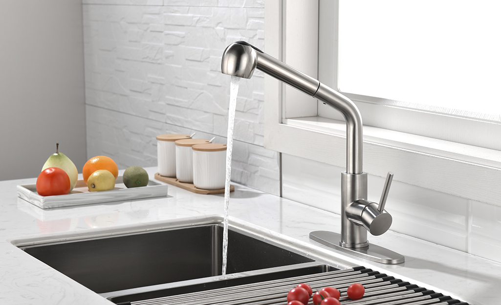 A stainless steel faucet with a level and built-in sprayer.