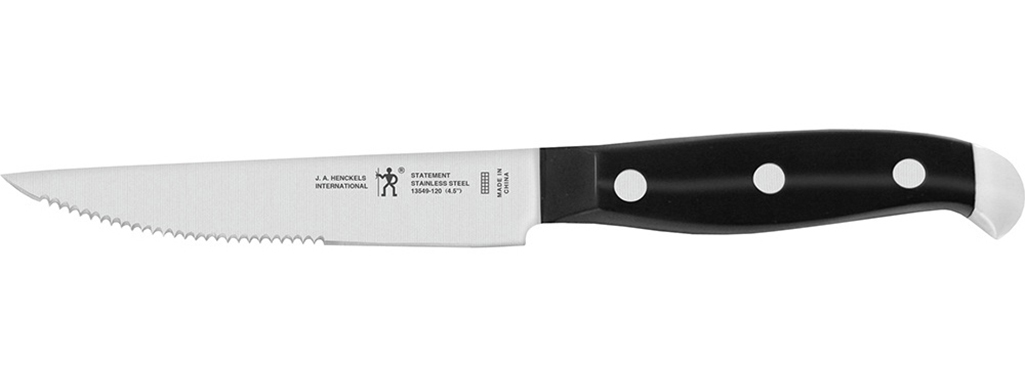 A steak knife with a black handle.