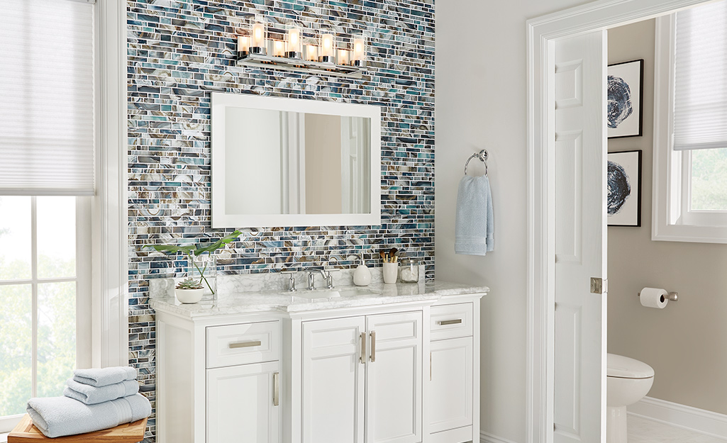 A picture of a bathroom featuring elements of modern design.