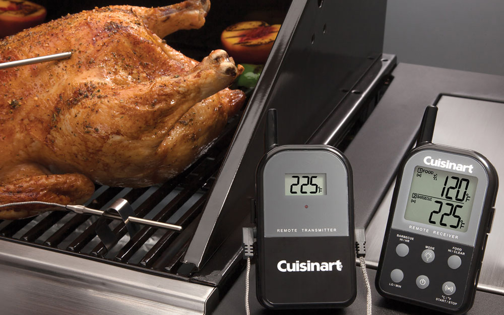 A leave-in digital meat thermometer shows the temperature of poultry with an external display.