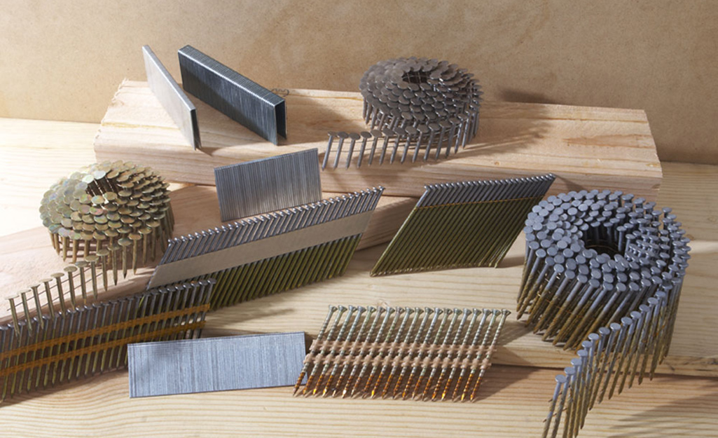 An assortment of collated nails of different gauges.