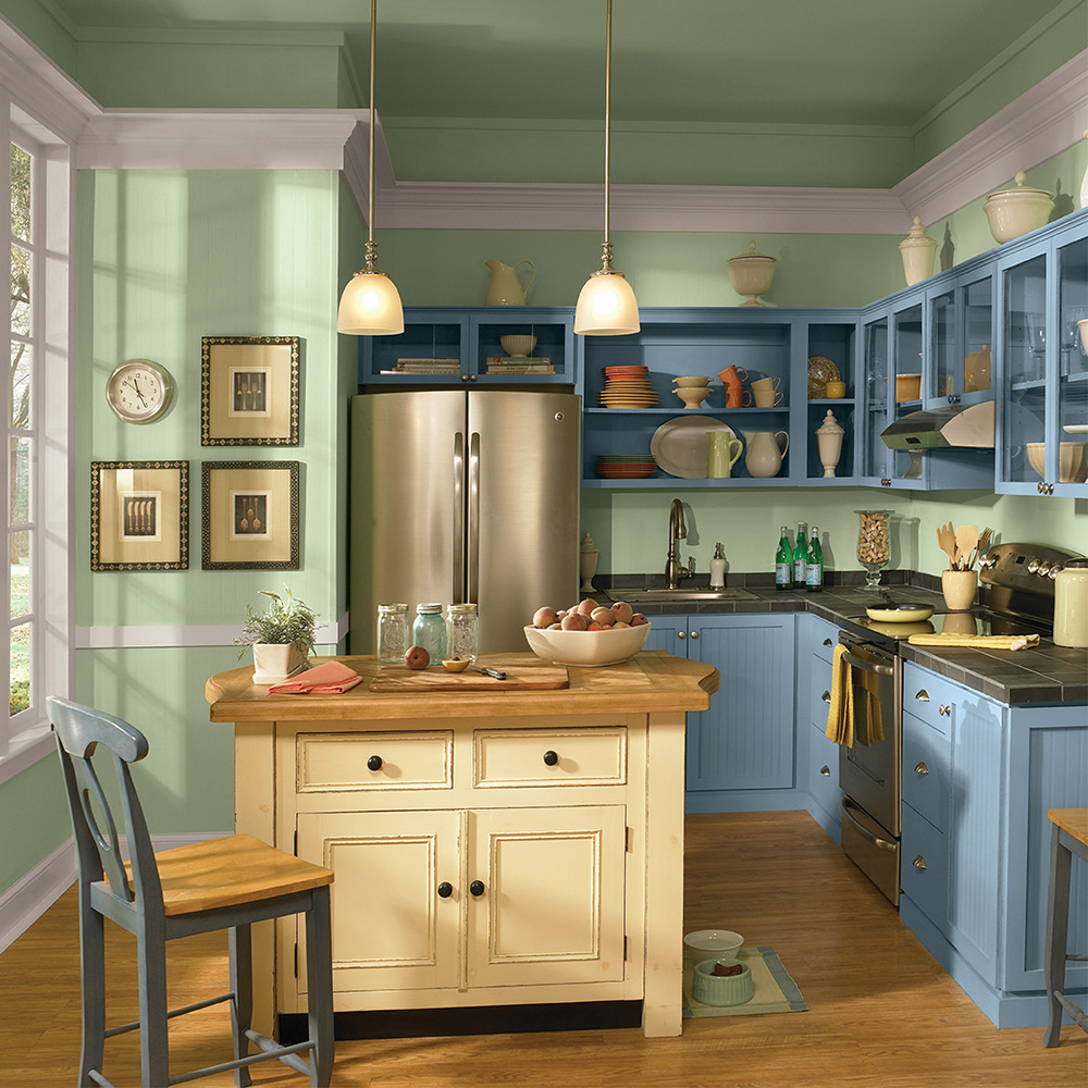 A green kitchen with blue cabinets