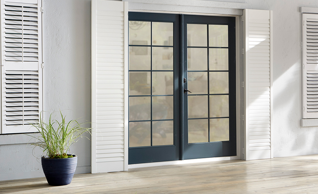 A patio door with a black frame.