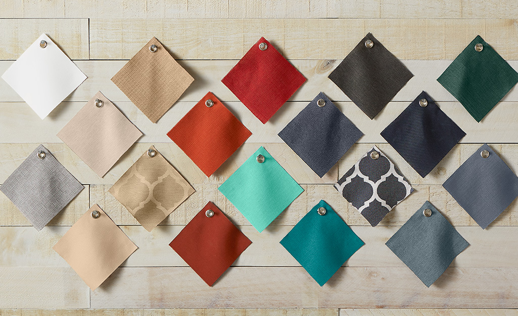 Swatches of different colored and patterned fabric. Swatches of different colored and patterned fabric.