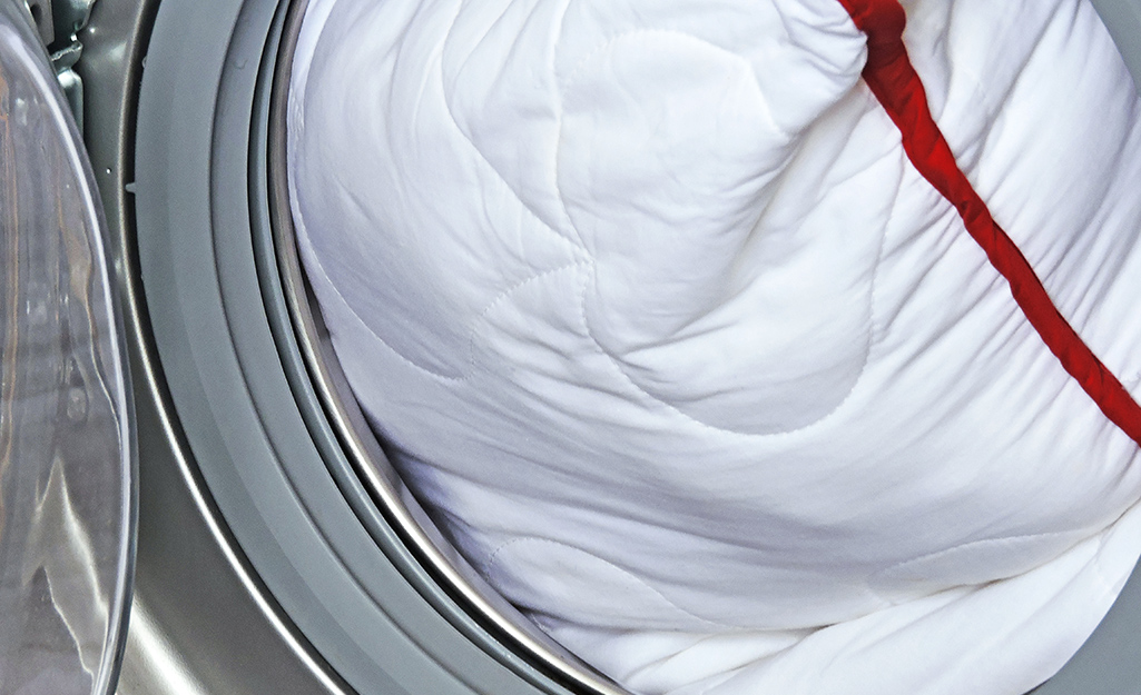 A pillow in a washing machine.