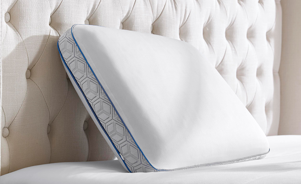 A memory foam pillow on a bed.