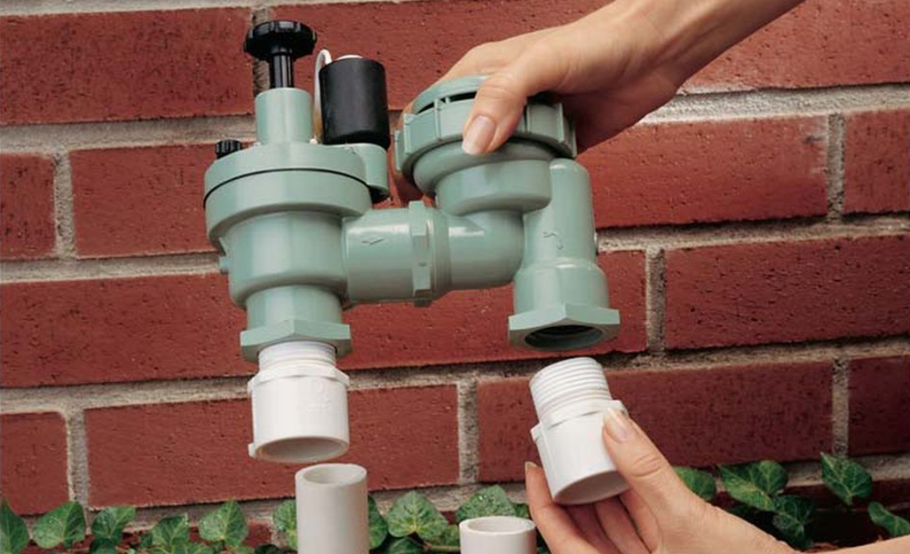 A green sprinkler valve