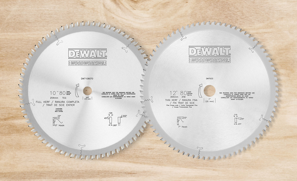 Two table saw blades of different kerf styles.