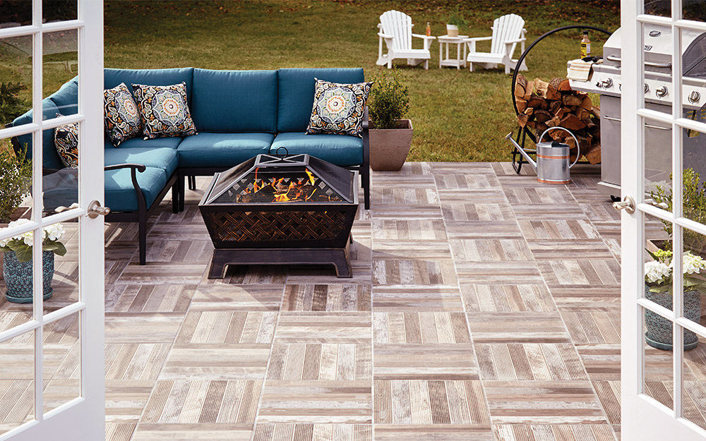 A deck with outdoor tile flooring. 