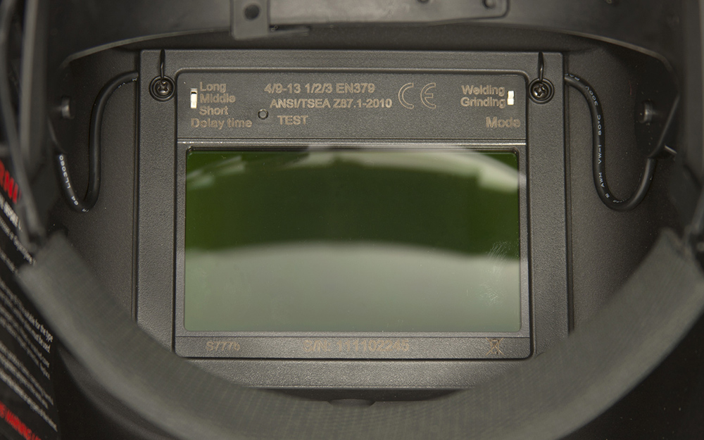A close up of a welding helmet lens