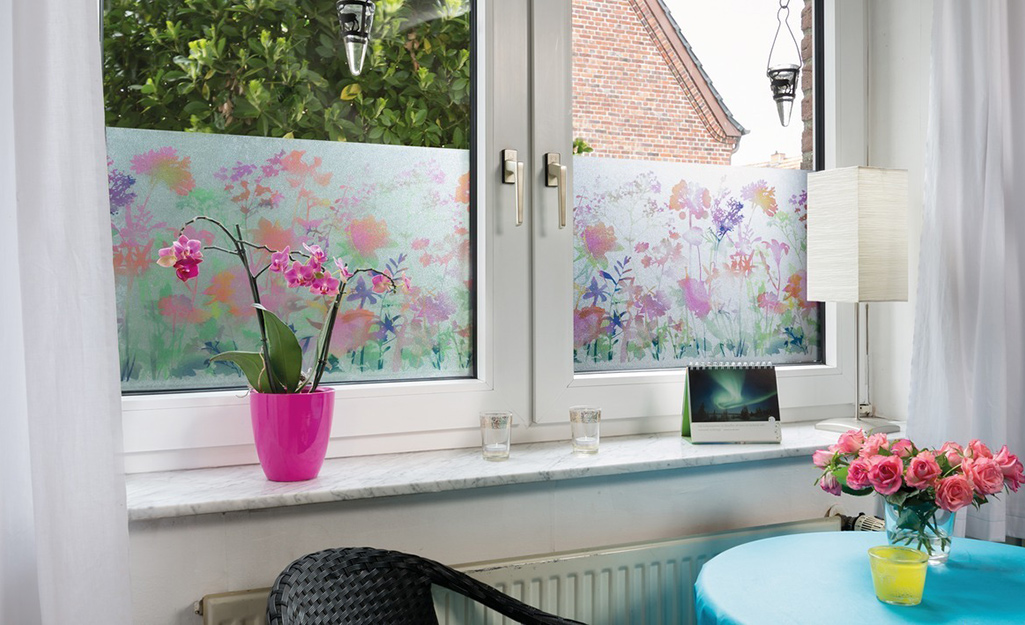 A window coated with decorative floral window film.