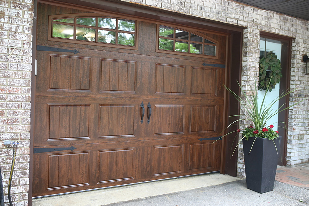 A home with new wooden garage doors.