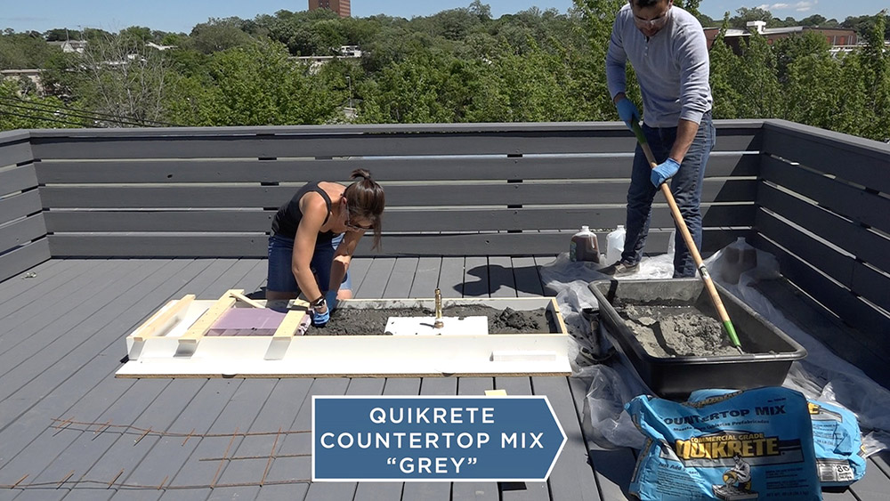 A team of people mixing concrete 