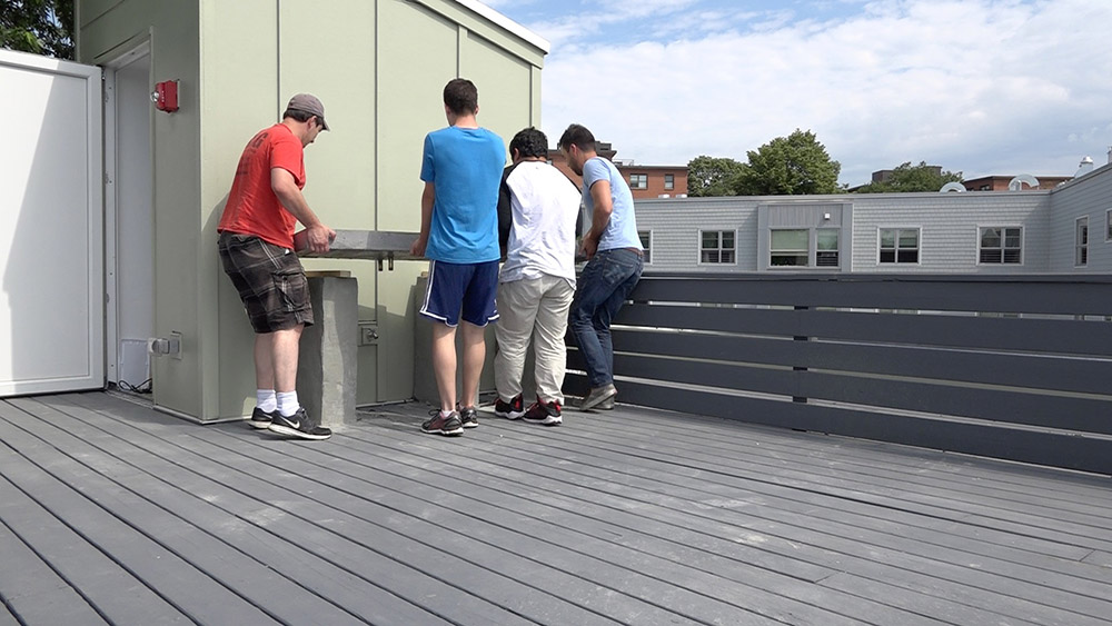 A team of people placing a countertop 