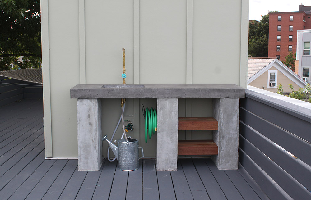 A kitchen countertop made of concrete on a roof top