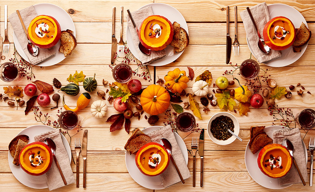 A dining table with fall decor.