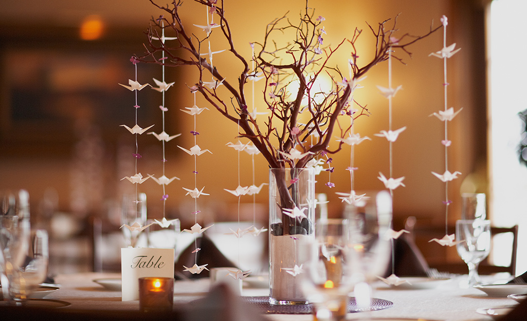 A centerpiece with white origami cranes.