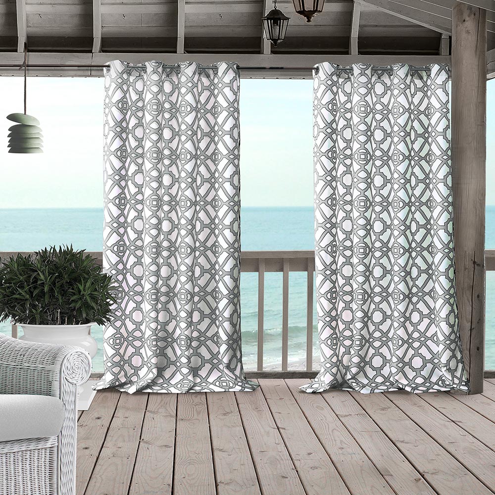 Outdoor curtains on a large patio. 