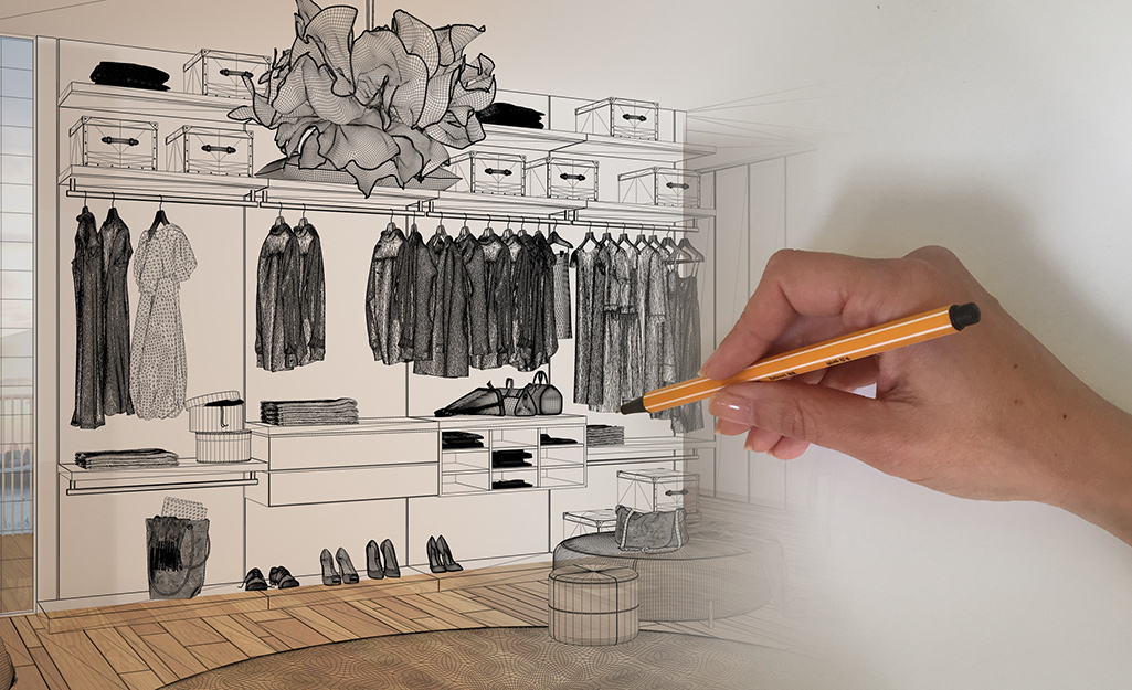 A person drawing a closet organization plan.